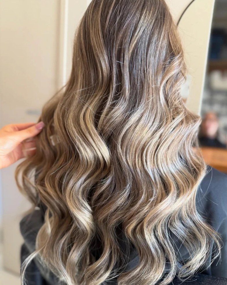 Blonde balayage with soft waves