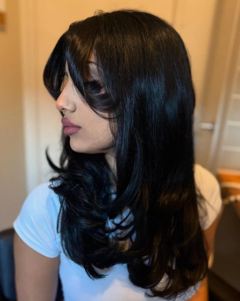 Glossy black layered cut with curtain fringe